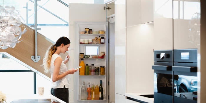Woman looking into her fridge