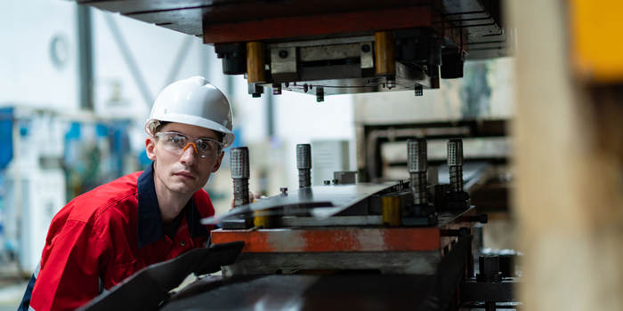 Worker using an industrial machine