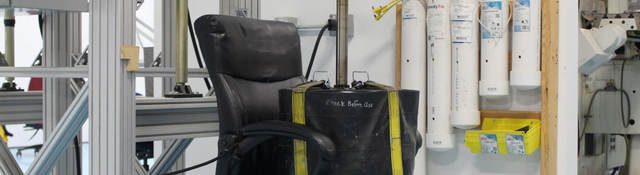 A weight sits on an office chair as part of testing