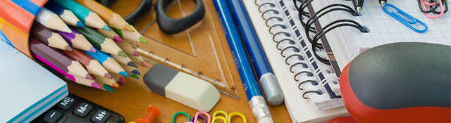 Assorted office supplies, notebooks, pencils