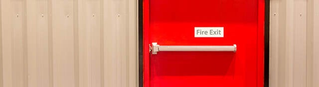 Red door with fire exit sign