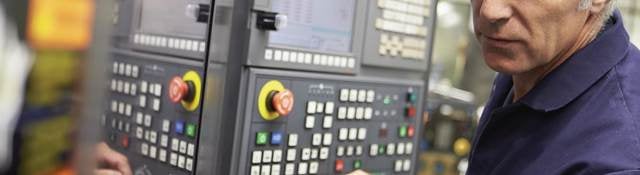 Technician working on an industrial control panel