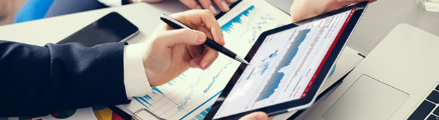 Image of two people’s hands holding a tablet, displaying Connect Analytics for Product iQ