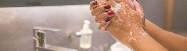 hands washing in a sink