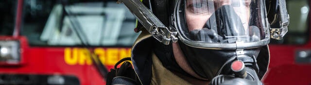 Fireman with breathing mask close up