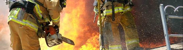 Firefighters working on roof