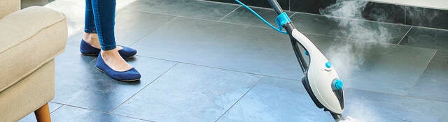 Steam cleaner mop cleaning a floor