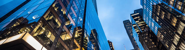  Skyscrapers at dusk, with lit offices