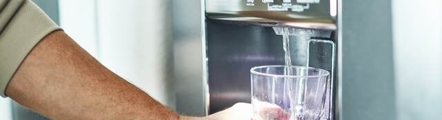 Filling a class with water from a refrigerator 