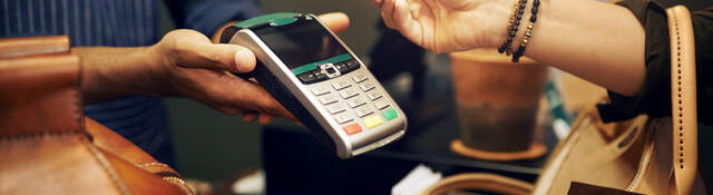 woman holding a credit card for payment