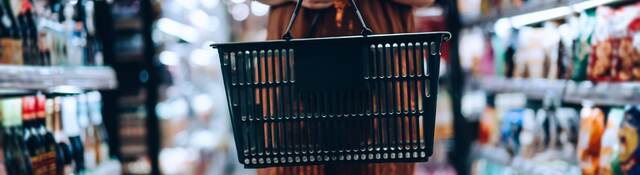 Woman carrying a shopping basket