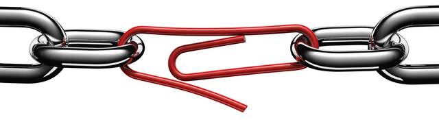 Steel chain links connected by a strained red paper clip.