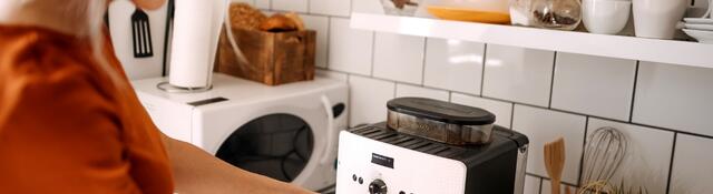 A person using a coffee maker