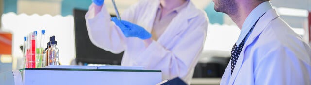 A man and a woman in a laboratory
