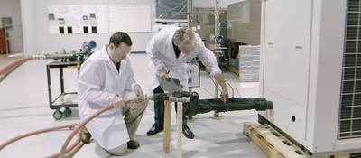 Two UL engineers testing an HVAC unit in a laboratory