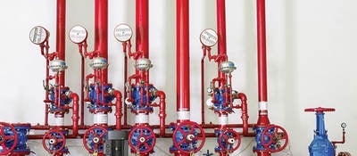 Red pumps and valves in a fire station. 