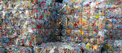 Cubes of crushed plastic bottles waiting for recycling