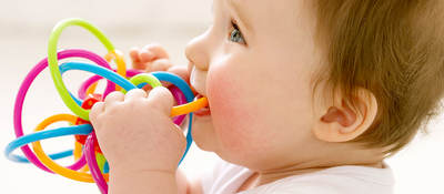 Baby playing with a teething toy 
