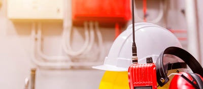 Standard construction safety equipment in a control room.