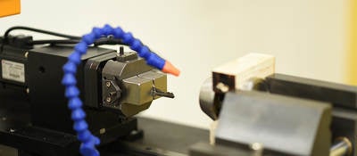 A lock cylinder being cycled to determine durability of the mechanism