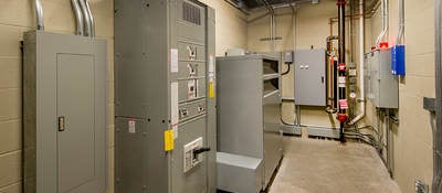 An electricalroom with circuit breakers.