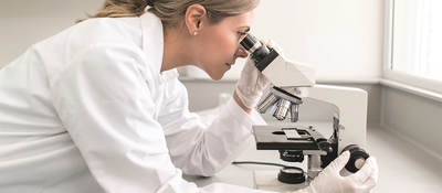 Scientist with Microscope