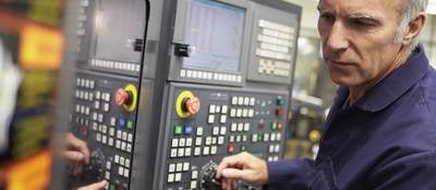Technician working on an industrial control panel