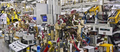 Robotic machines in a factory setting. 