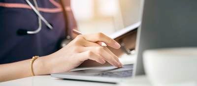 nurse using a laptop