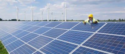 Man checking on solar panels