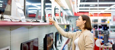 woman buys the TV