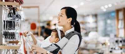 Asian women with baby shopping at department store