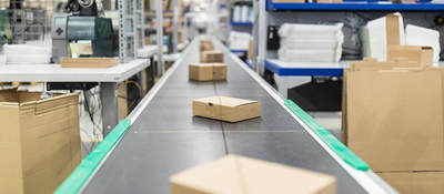 Photo of cardboard boxes on a conveyor belt