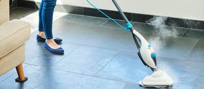 Steam cleaner mop cleaning a floor