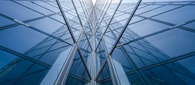 Modern blue glass building mirror reflections