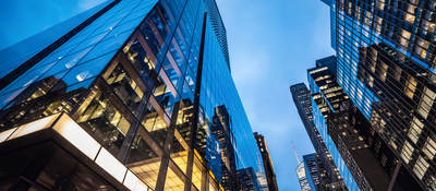  Skyscrapers at dusk, with lit offices