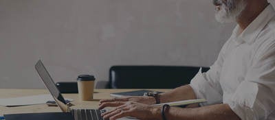 Man sitting in front of computer at a desk