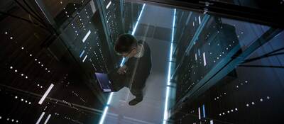 Top down view of man working in a data center 