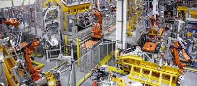 Robots putting cars together in a factory