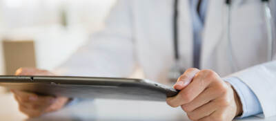 Doctor looking at a tablet