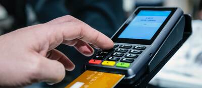 man using a payment terminal