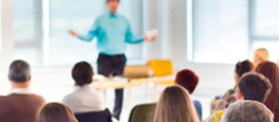 People listening to a presentation