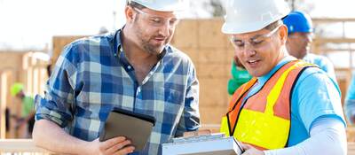 Construction managers discuss building plans