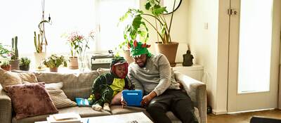 Father and son playing with a connected toy