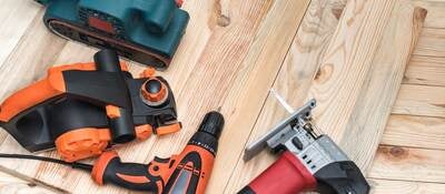 Power tools on planks of wood