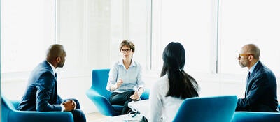 Group of business professionals having a discussion