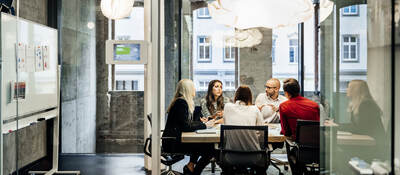 People having a meeting in a conference room