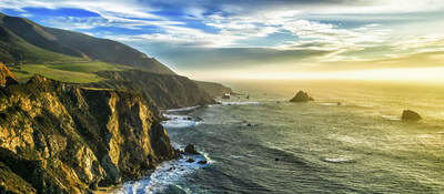 The coastline at Big Sur, California, with steep cliffs and rock stacks in the Pacific Ocean