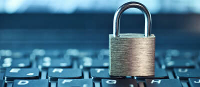 an image of a locked padlock sitting on a keyboard