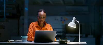 Person looking at a laptop computer.
